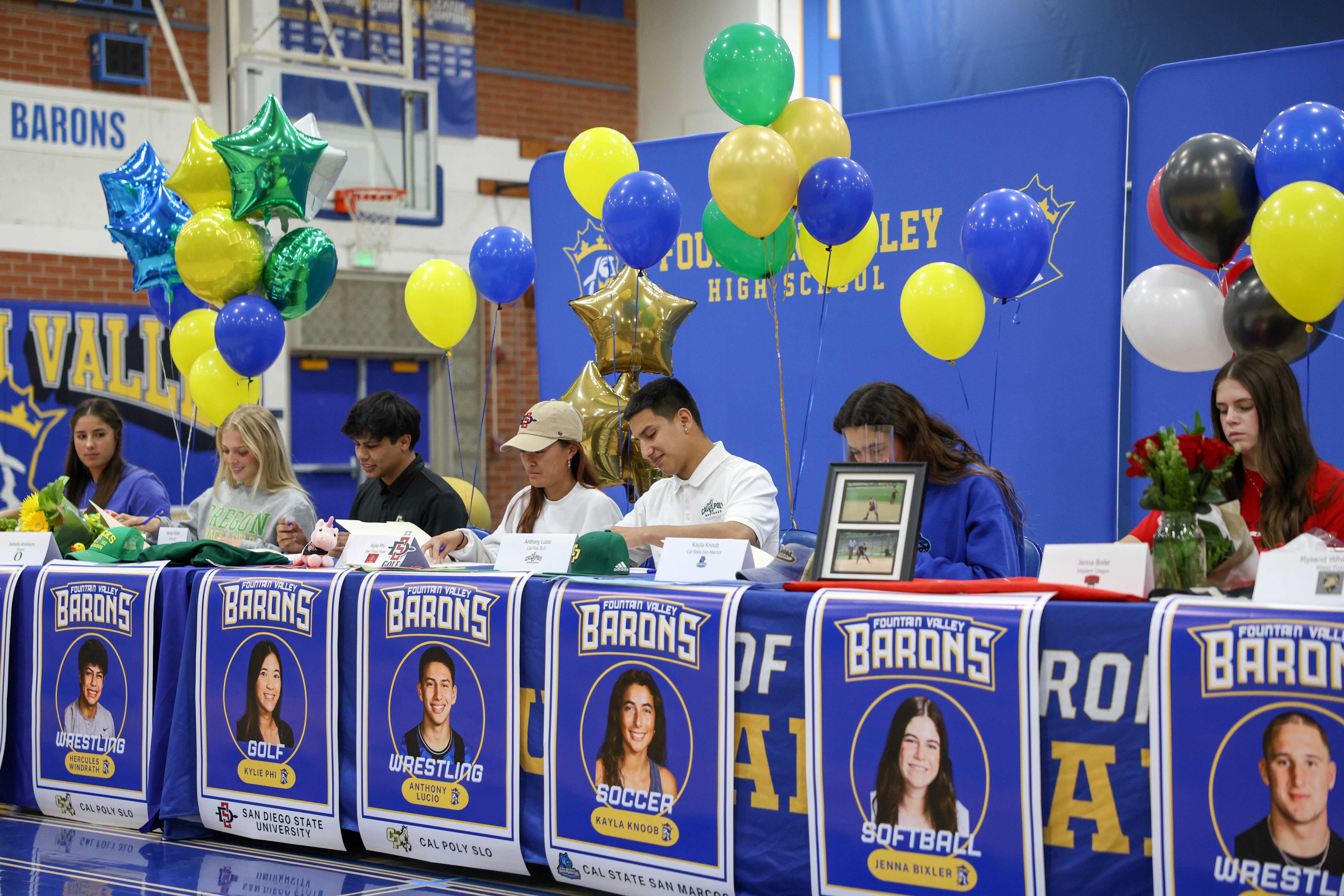 student-athletes signing their letters of intent